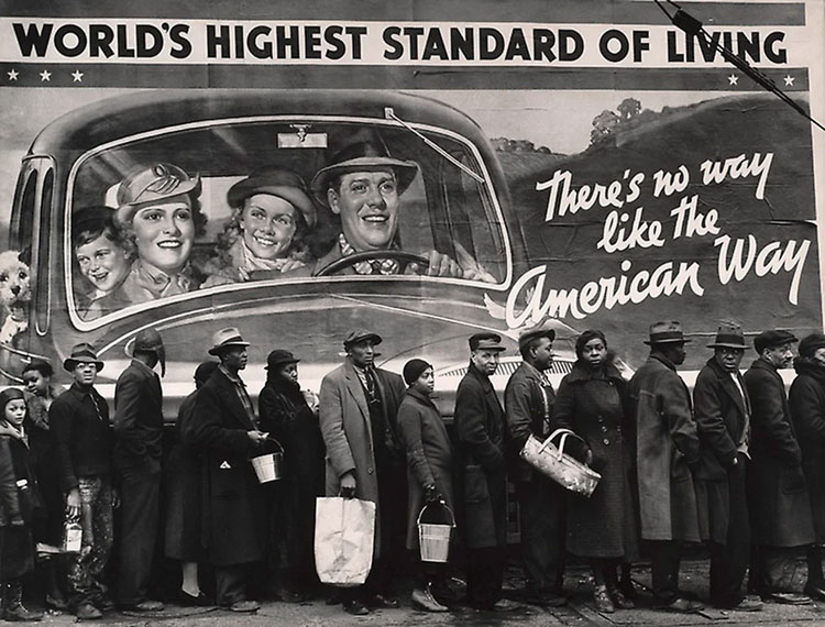A line of people in need of assistance against the backdrop of bright American lifestyle advertisements. Photo by Margaret Bourke-White/Public Domain.