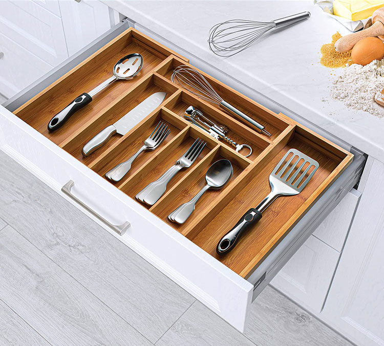 Experience optimal organization and elegance with the Bambüsi Bamboo Kitchen Drawer Organizer. Its expandable design and adjustable compartments allow you to create a tailored layout for your utensils and kitchen tools. Crafted from premium bamboo, it offers exceptional durability and adds a natural, eco-friendly charm to your kitchen. With its deep slots, efficient organization becomes effortless. Cleaning and maintenance are hassle-free, while the non-slip base ensures stability. Elevate the organization and style of your kitchen with this sophisticated and eco-conscious drawer organizer from Bambüsi.
